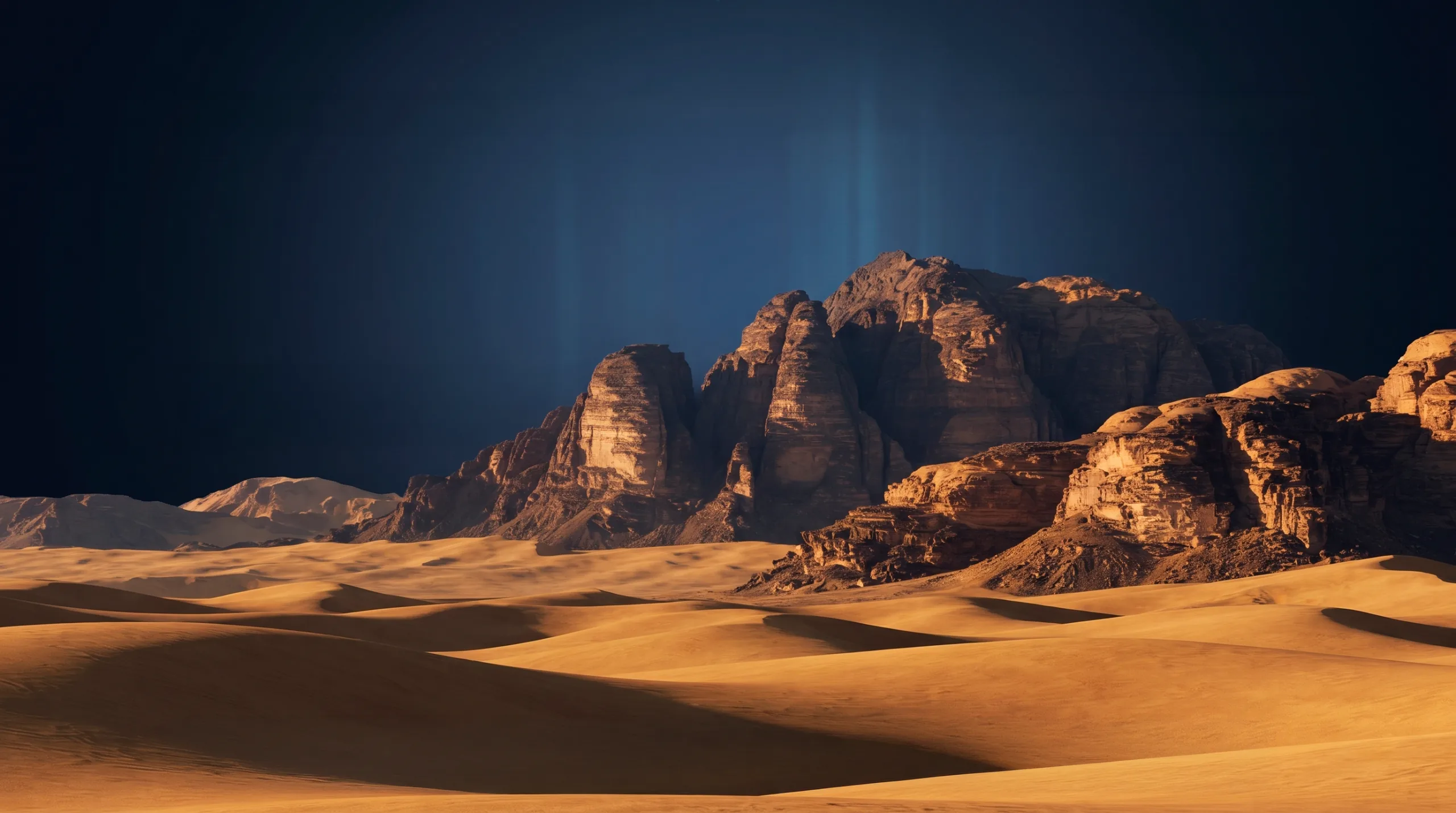 Desert dunes beneath a dark, glowing sky